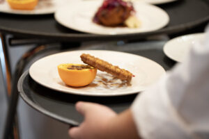 A desert leaned up against an orange